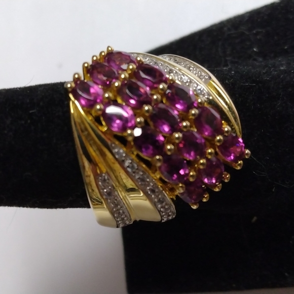 Stamped .925 Orissa Rhodolite Garnet and Diamond Ring.8.86...